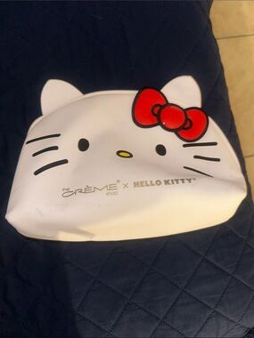 The Crème Shop x Hello Kitty White Cosmetic Pouch with Red Bow Accent Make Up